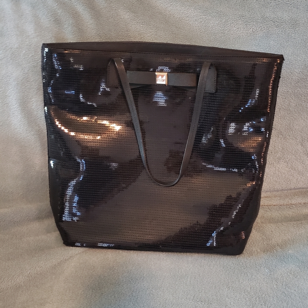 Large black sequins purse with 2 small straps. Very good condition. Not used.